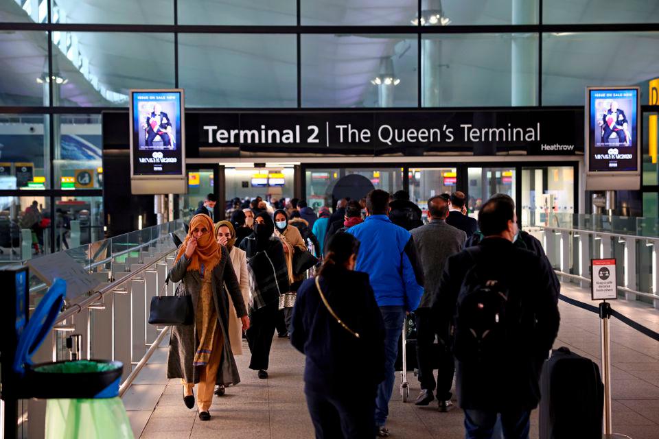 People queue to enter terminal 2, at Heathrow Airport. REUTERSPIX