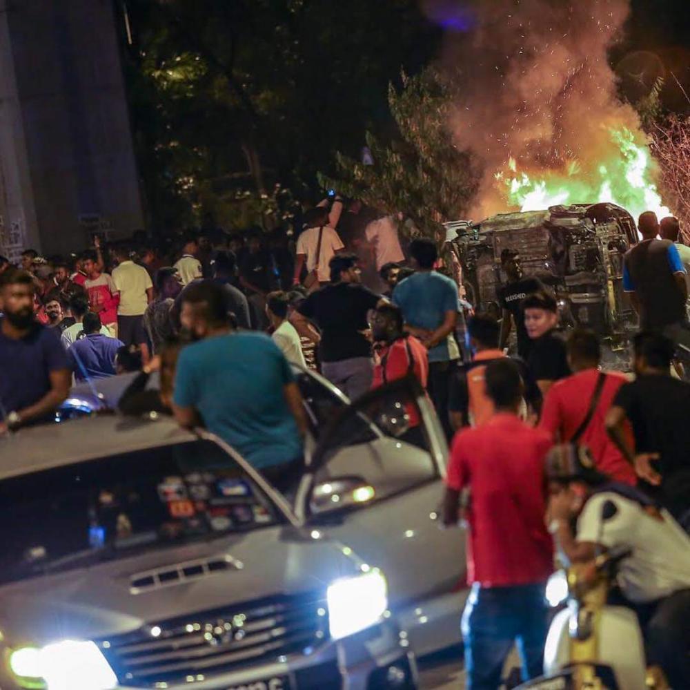 ( Video) Mayhem at temple, cars set on fire