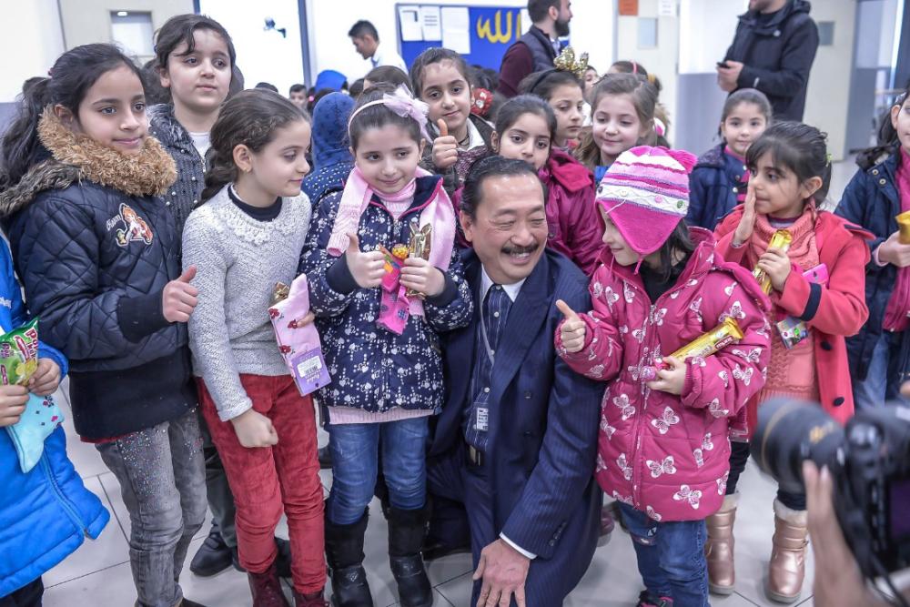 Tan Sri Vincent Tan is having a conversation with the children at El Menahil International School in Istanbul, Turkey on Dec 29, 2018. — Sunpix by Adib Rawi Yahya