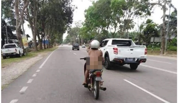 Have bike will travel for naked motorcyclist
