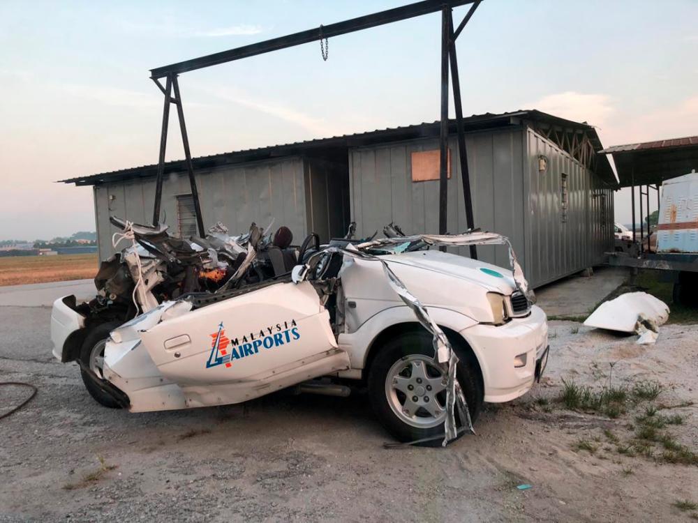 The wreck of a Perodua Kembara after the collision with a private aircraft at Sultan Abdul Aziz Shah Airport, Subang on March 18, 2019.