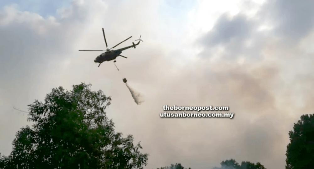 A screenshot of water bombing operations to douse the raging fire at Kuala Baram.