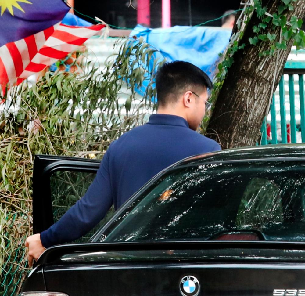 Haziq seen leaving the Kelana Jaya police station after lodging a police report. He was accompanied by his lawyer. — Sunpix by Masry Che Ani