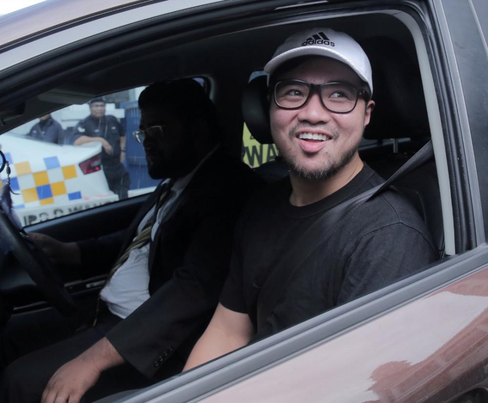 Sacked PKR Santubong Youth Cheif Haziq Abdullah Abdul Aziz who claims to be one of the 2 persons in the sex scandal video is being released from the Dang Wangi Police HQ, Kuala Lumpur. July 23, 2019.