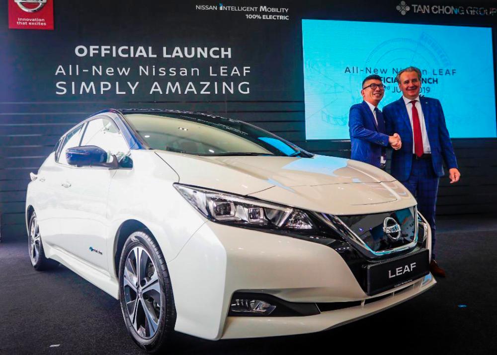 Nissan Asia &amp; Oceania senior vice-president Vincent Wijnen (at right) with ETCM sales and marketing director Christopher Tan unveiling the all-new, second-generation Nissan Leaf to the crowd, this morning.