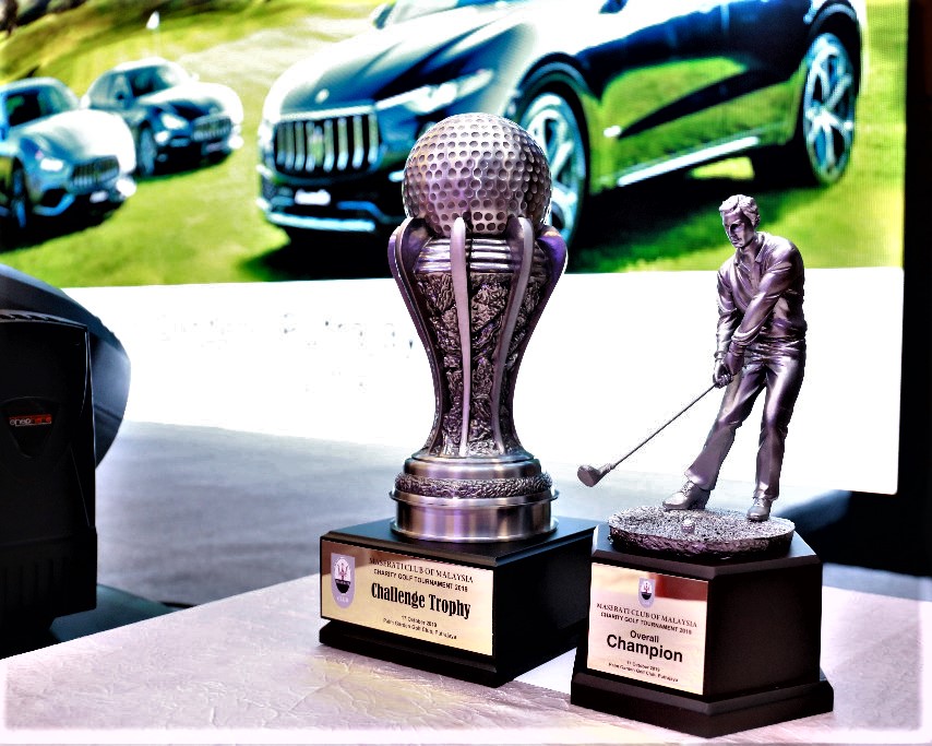 The trophies offered in the MCOM charity golf tournament.