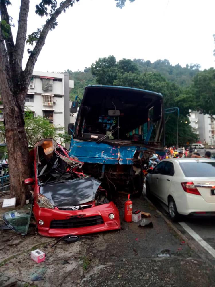 A bus driver had ploughed his bus into five stationary vehicles to reduce its speed after the brakes apparently failed at a steep road. — Sunpix