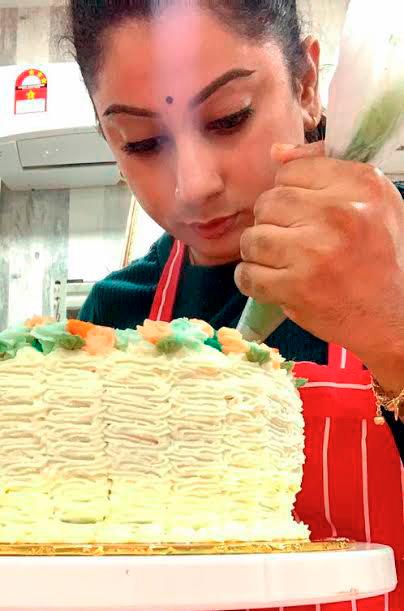 $!Gaayathri Manimaran icing a cake. -courtesy of Gaayathri Manimaran