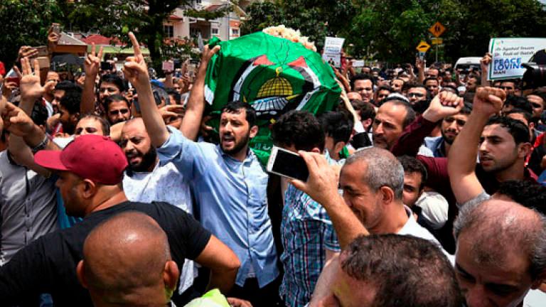 The body of assassinated Palestinian lecturer and imam, Dr Fadi Mohammed Al Batsh, accompanied by a crowd during his funeral procession in Kuala Lumpur on April 25, 2018. BERNAMApix