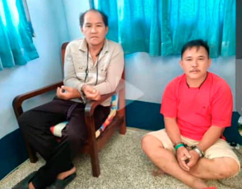$!Two Penan protestors in handcuffs after being arrested during an anti-logging protest at Long Tepen forest in Baram.