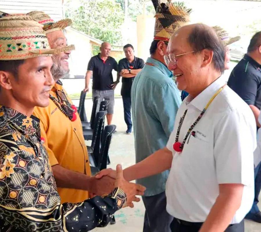 Sarawak Deputy Minister for project monitoring, labour and immigration Datuk Gerawat Gala greeting natives in Long Kevok in Baram district in northern Sarawak. Pix by Datuk Gerawat office