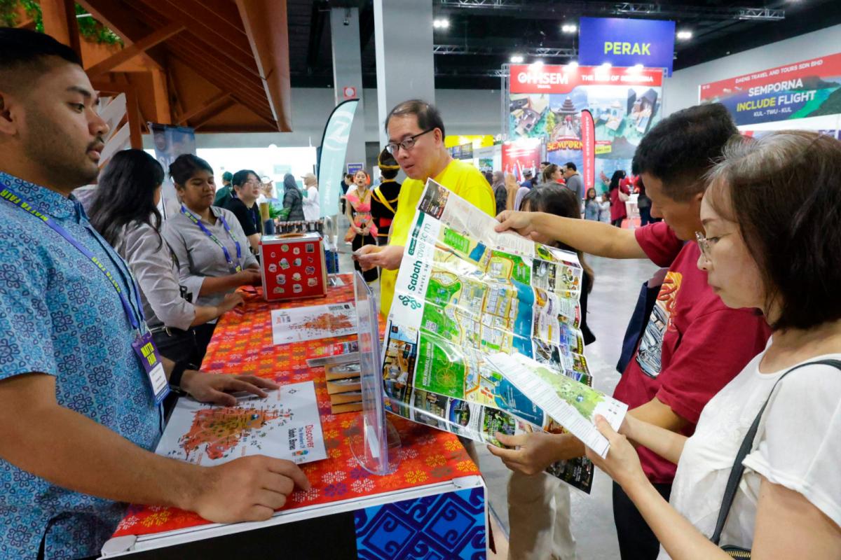 Visitors at the booth highlighting Sabah’s diverse attractions alongside initiatives in nature conservation, heritage preservation, and sustainable tourism practices.