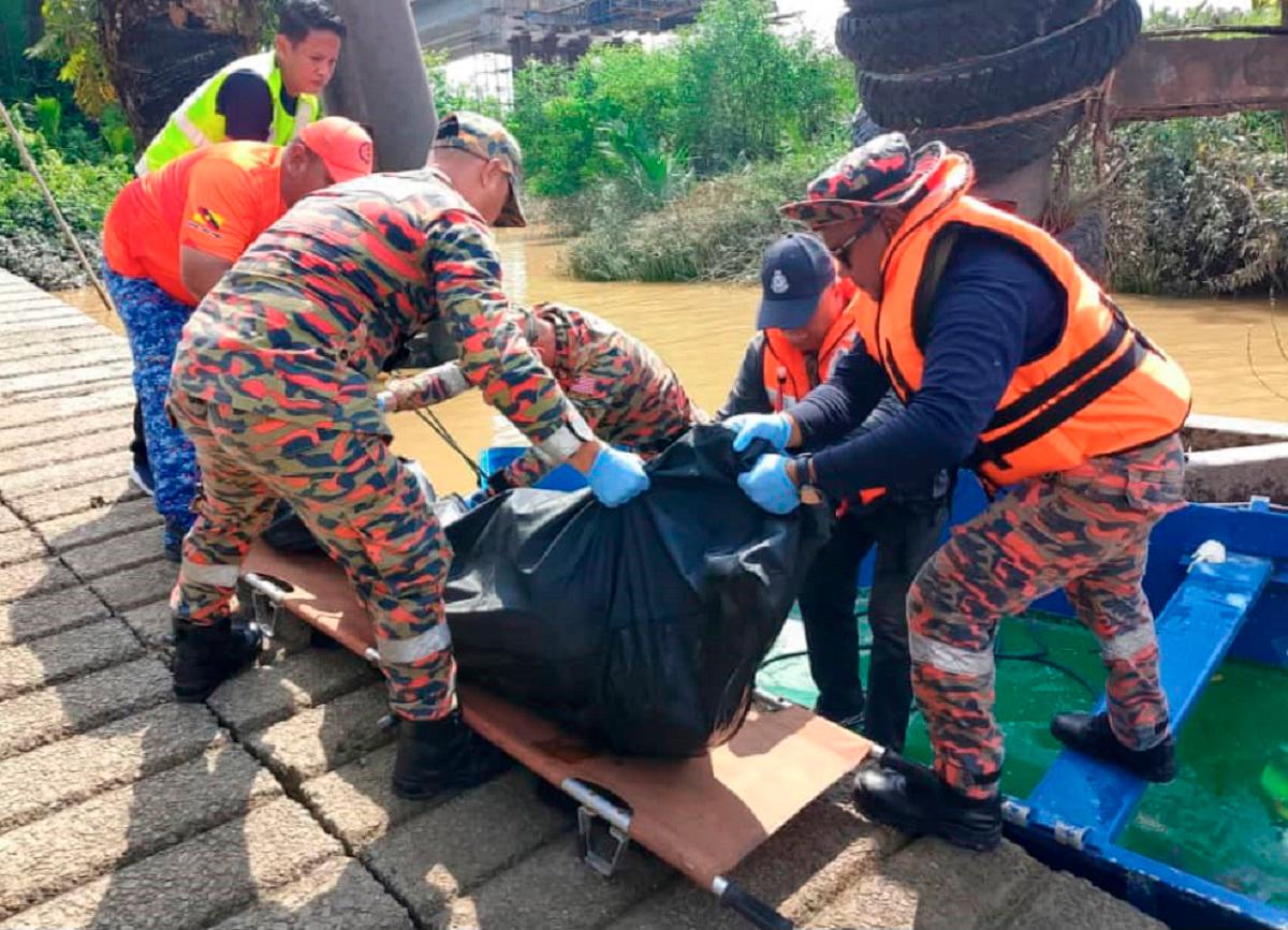 The remains of one of the four workers being recovered by Fire and Reacue personnel. - Pic courtesy of Sarawak Fire and Rescue Department