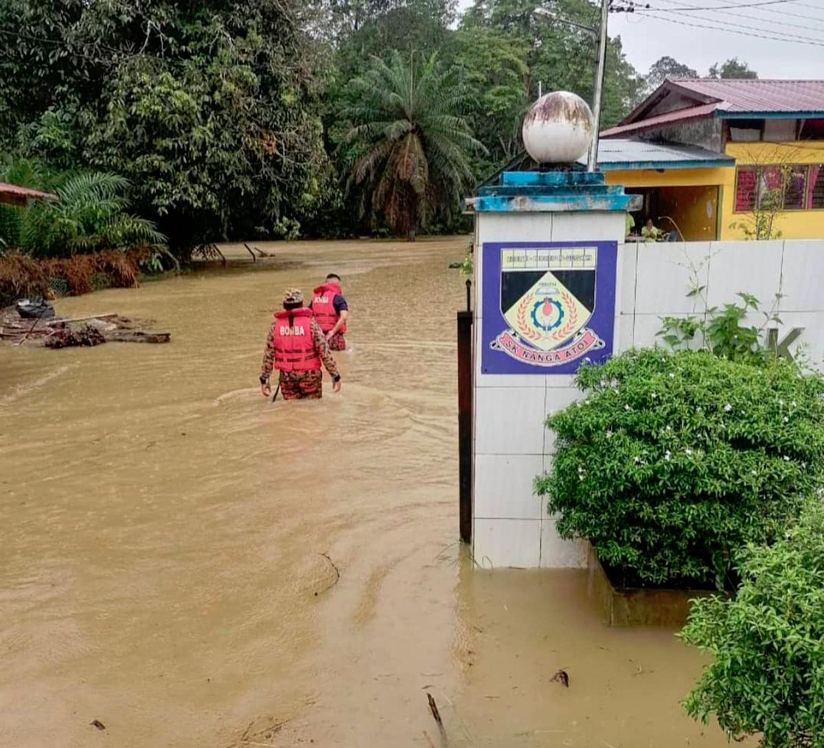 The Saratok district hit by sudden floods as emergency evacuation gets carried out in schools and longhouses. - Pic courtesy of Sarawak Fire and Rescue Department
