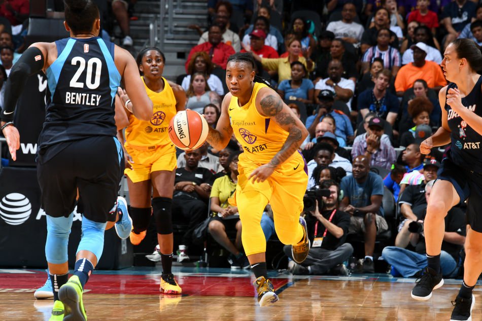 Riquna Williams (C) #2 of the Los Angeles Sparks brings the ball up the court against the Atlanta Dream on JULY 14, 2019 at the State Farm Arena in Atlanta, Georgia. — AFP