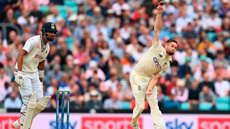 England’s Chris Woakes (right) bowls during play on the first day of the fourth cricket Test match against India at the Oval cricket ground in London. – AFPPIX