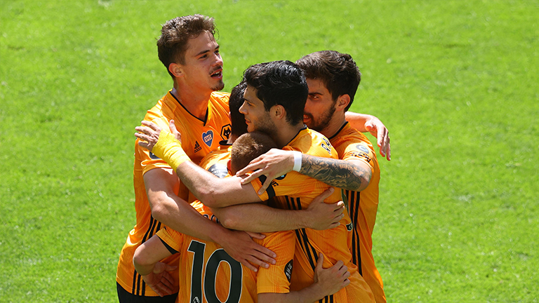 Wolverhampton Wanderers’ Raul Jimenez (right) celebrates with teammates after scoring a penalty during his team’s Premier League match against Everton at the Molineux stadium. – AFPPIX