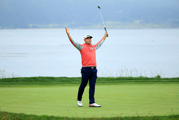 Gary Woodland of the United States celebrates on the 18th green after winning the 2019 US Open at Pebble Beach Golf Links on June 16, 2019 in Pebble Beach, California. – AFP
