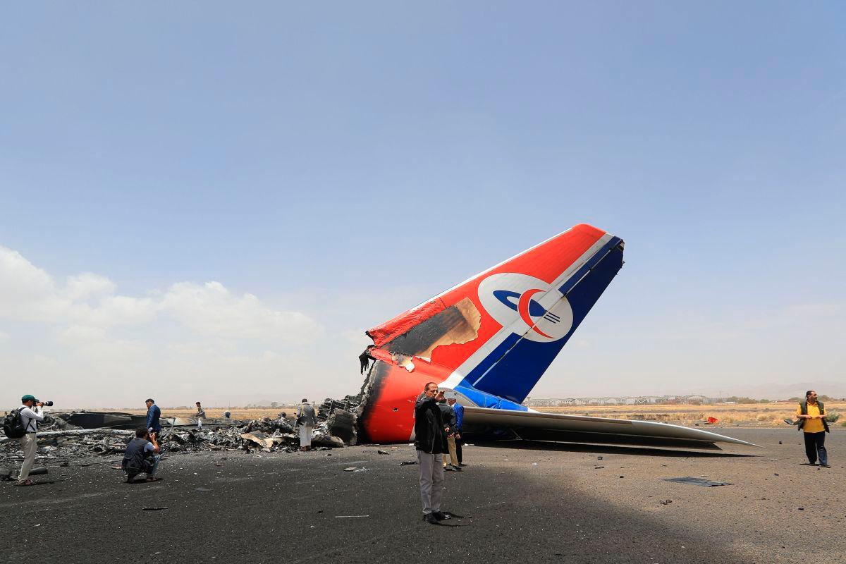 Journalists inspect a destroyed plane on the tarmac at the Sanaa International Airport on May 7, 2025. AFPpix