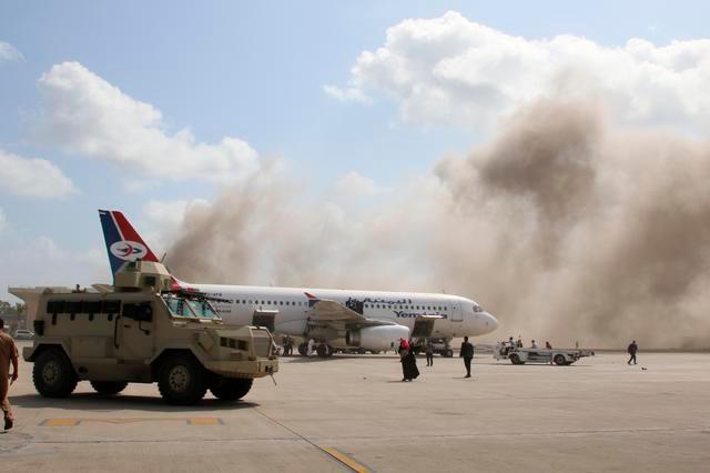 A military vehicle is seen on the tarmac as dust rises after explosions hit Aden airport, upon the arrival of the newly-formed Yemeni government in Aden, Yemen December 30, 2020. — Reuters