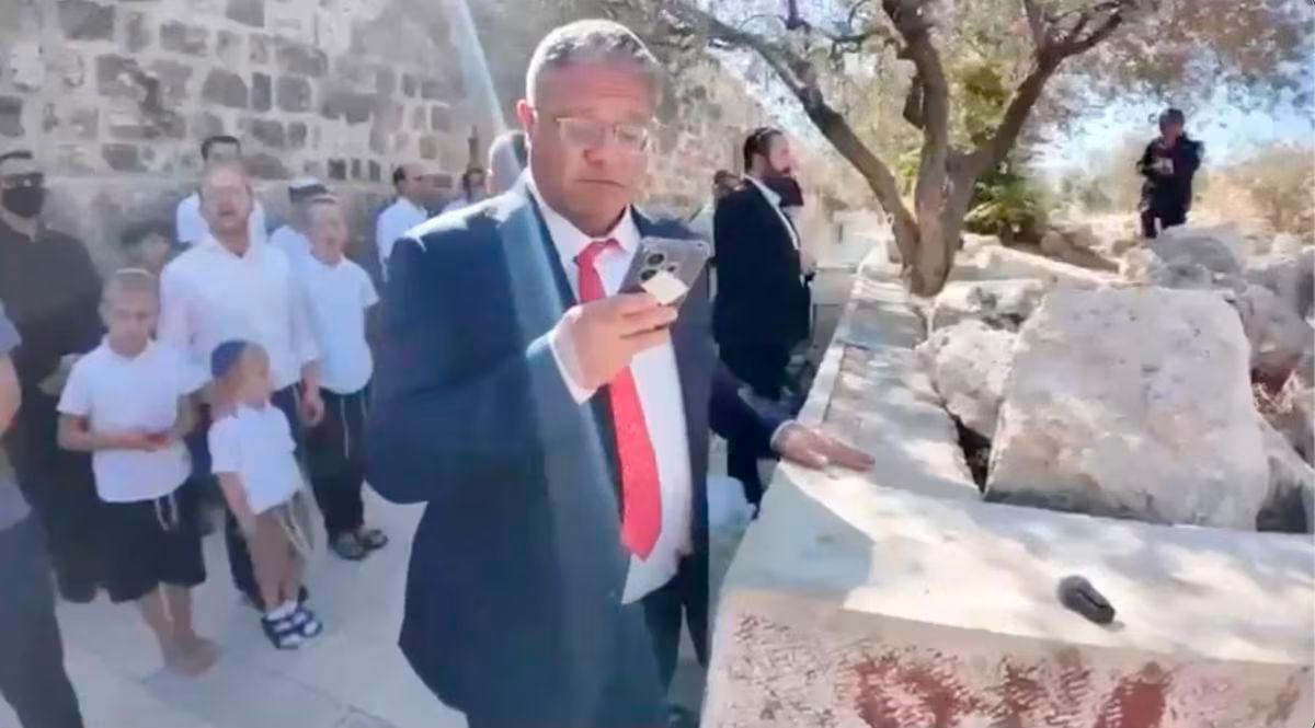 Israeli National Security Minister Itamar Ben-Gvir prays at the Al-Aqsa Mosque compound during the Jewish holiday of Sukkot, in the Old City of Jerusalem, in this screengrab from a video obtained by Reuters on October 8, 2025. Jewish Power/Handout via REUTERS