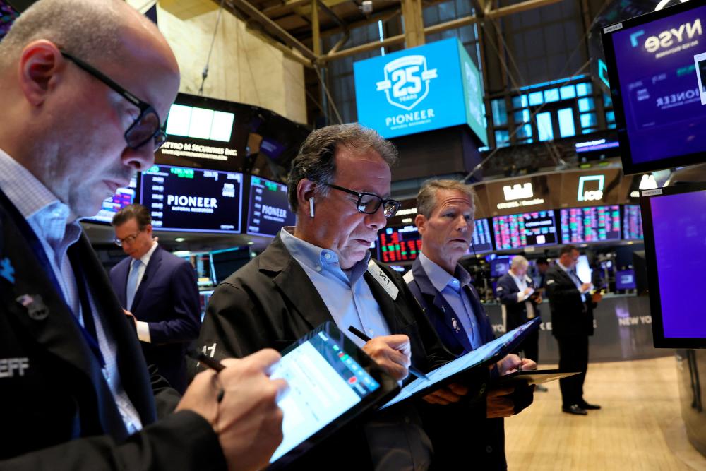 Traders working on the floor of the New York Stock Exchange on Wednesday, Aug 7. – Reuterspix