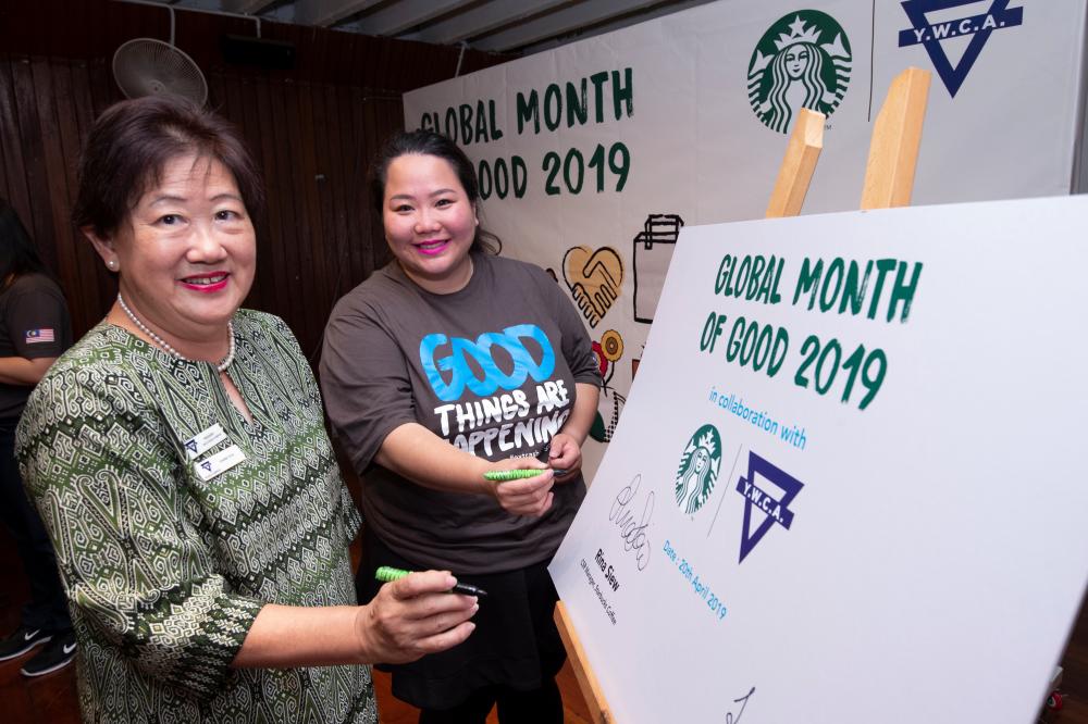 From left: Yeoh and Siew officiating the Starbucks Global Month of Good 2019 event.