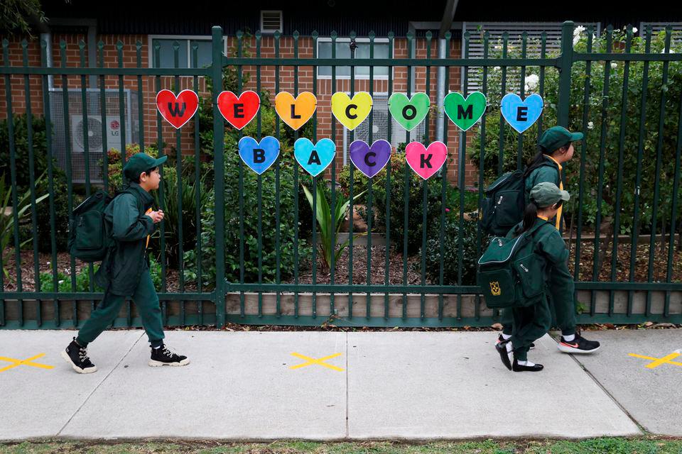 Children return to campus for the first day of New South Wales public schools fully re-opening for all students and staff amidst the easing of the coronavirus disease (COVID-19) restrictions at Homebush West Public School in Sydney, Australia, May 25, 2020. REUTERSpix