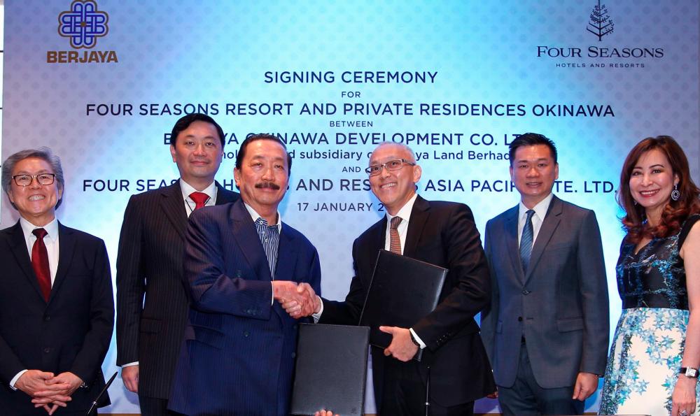 Berjaya Corporation Bhd executive chairman Tan Sri Vincent Tan exchanging documents with Four Season Hotels and Resorts senior vice president of development, Asia Pacific, Christopher Wong at the signing ceremony for Four Seasons Resort and Private Residences Okinawa between Berjaya Okinawa Development Co. Ltd. and Four Seasons Hotels and Resorts Asia Pacific Pte. Ltd. - ZULKIFLI ERSAL/THESUN
