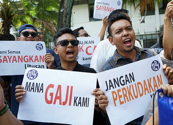About 100 Utusan Melayu workers held a protest today outside its headquarters. — Sunpix by Zulfkifil Ersal