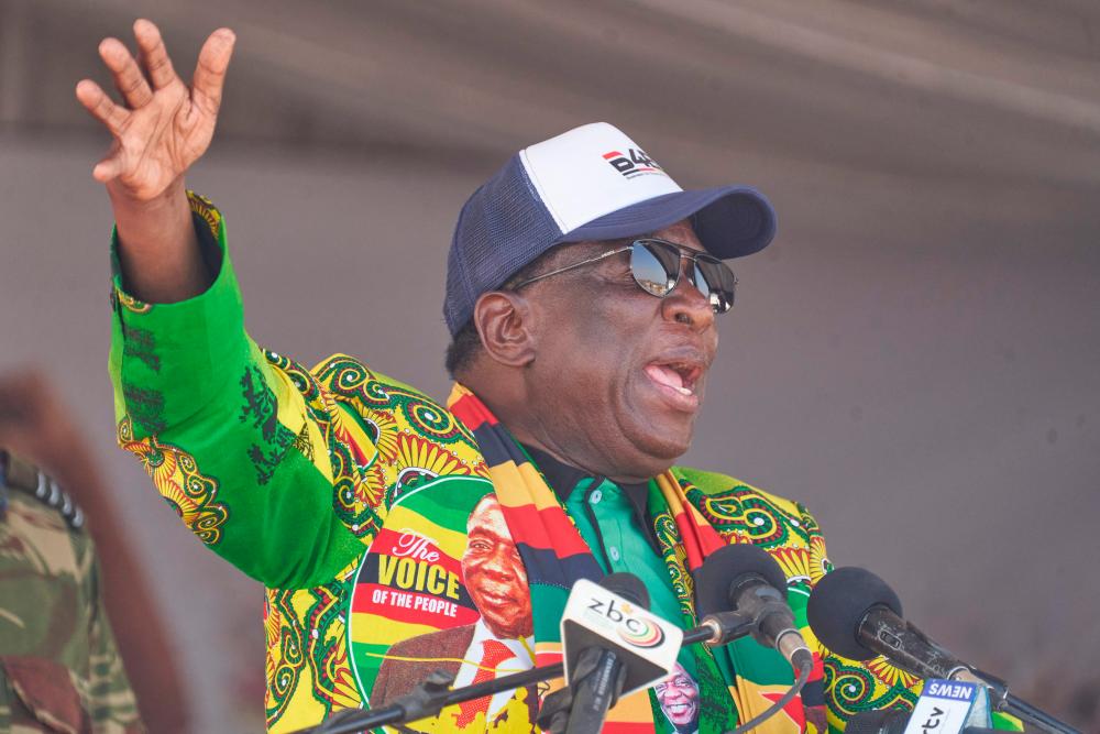 President of Zimbabwe Emmerson Mnangagwa gestures during a Zimbabwe African National Union – Patriotic Front (ZANU-PF) election campaign rally in Shurugwi on August 19, 2023. AFPPIX