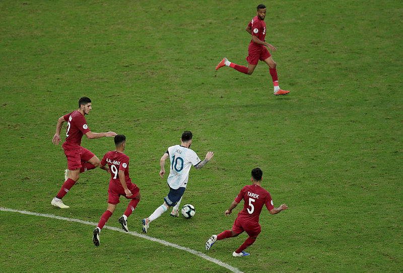 Argentina’s Lionel Messi trailed by three Qatari defenders behind, and one in front, during their Copa America Group B game, at Porto Alegre, on June 24, 2019. — AFP