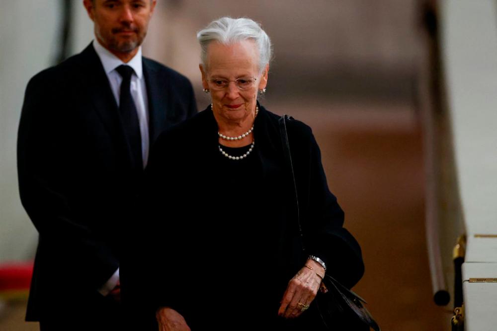 Denmark’s Queen Margrethe pays her respects to Britain’s Queen Elizabeth, following her death, during her lying-in-state at Westminster Hall, in London, Britain, September 18, 2022. REUTERSPIX