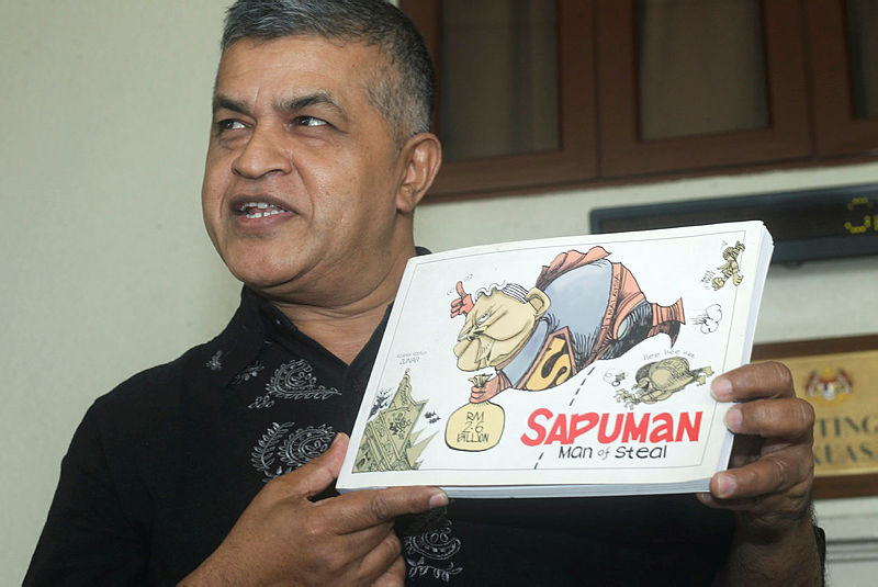 Filepix of Zunar with his book Sapuman: Man of Steal.