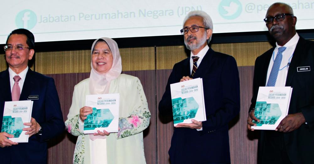 Zuraida (second from left) with from left Housing and Local Government Ministry secretary-general Datuk Seri Mohammad Mentek, Deputy Minister Senator Datuk Raja Kamarul Bahrin Shah Raja Ahmad and National Housing Department director-general N. Jayaselan at the launch of Natiional Housing Policy 2018-2025. ZULKIFLI ERSAL/THESUN