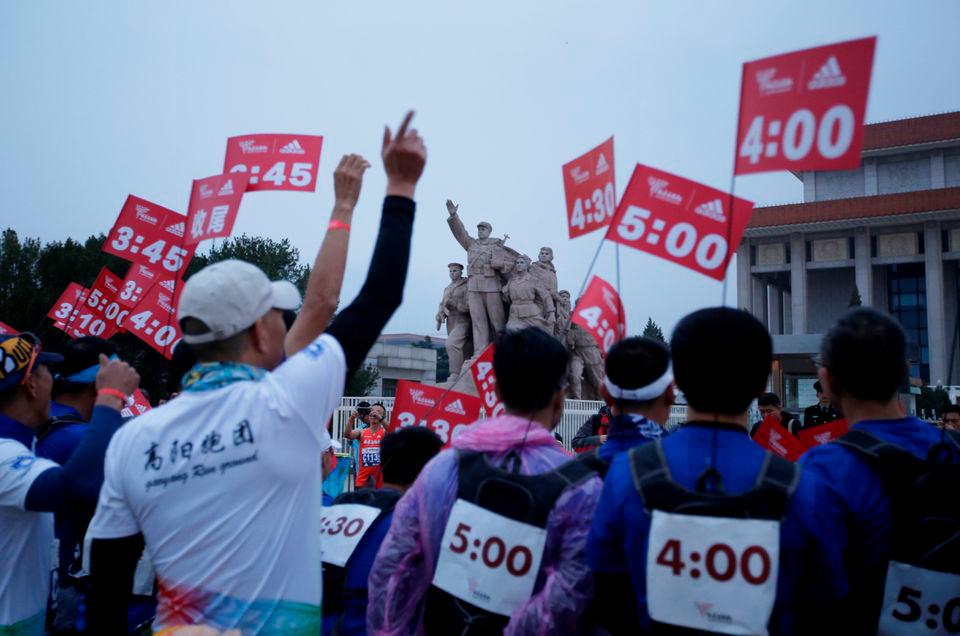 Staff members gather at Tiananmen Square before the start of the annual Beijing Marathon in Beijing, China November 3, 2019. REUTERSPIX