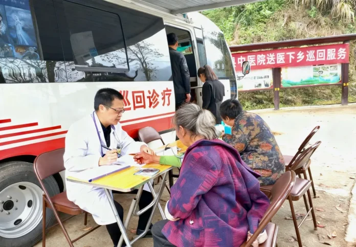 Zhejiang Mobile Inside the Zhejiang Mobile 5G‑enabled mobile clinic, a doctor is using connected diagnostic devices to examine patients and transmit real‑time data to upper‑level hospitals.