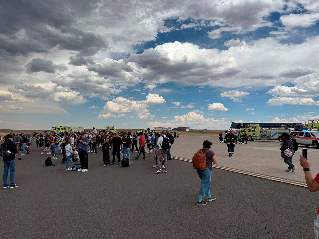 Passenger plane evacuated in Denver after brake fire incident Passenger plane evacuated in Denver after brake fire incident