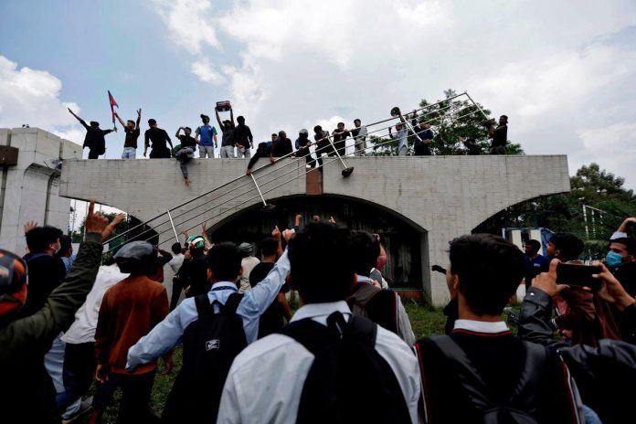 Nepali police fire tear gas and rubber bullets at protesters outside parliament