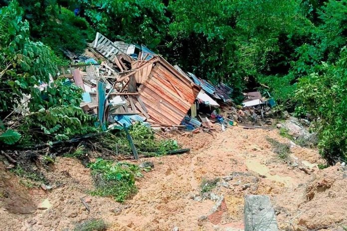 Seven landslides damage two houses in Kampung Kopungit, Sabah Seven landslides damage two houses in Kampung Kopungit, Sabah