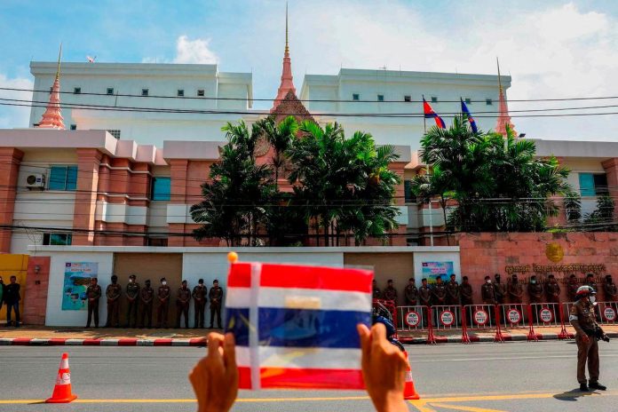 Thai police fire tear gas at Cambodian protesters at a disputed border village Thai police fire tear gas at Cambodian protesters at a disputed border village