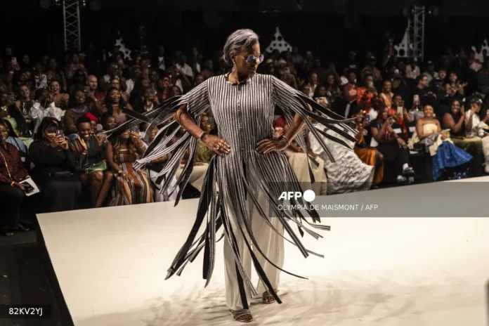 afp-20251031-82kv2yj-v1-mockup-fashionnigeria Kanyinsola Onalaja celebrates Nigerian heritage with bold, diverse designs at Lagos Fashion Week, blending tradition and modern flair.