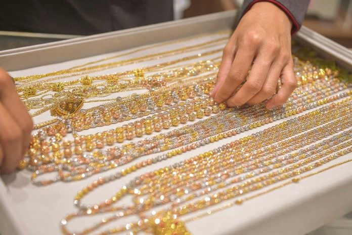 Gold rises on US rate cut bets; silver hits 14-year high