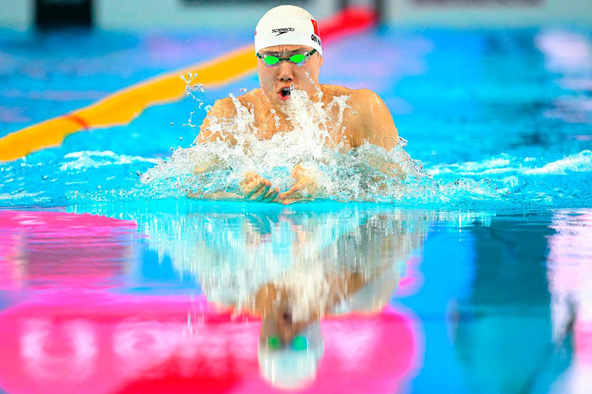 Qin targets LA 2028 gold after 100m breaststroke world title win