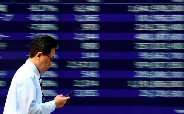 Asia shares dip as tariffs weigh on EU and US growth