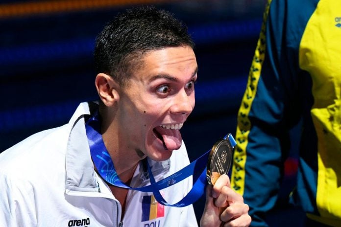 Popovici eyes beach holiday after world swim sprint double win