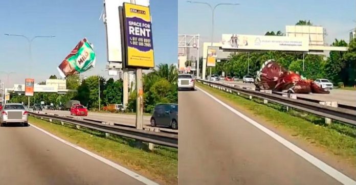 Billboard canvas along Federal Highway falls on moving car