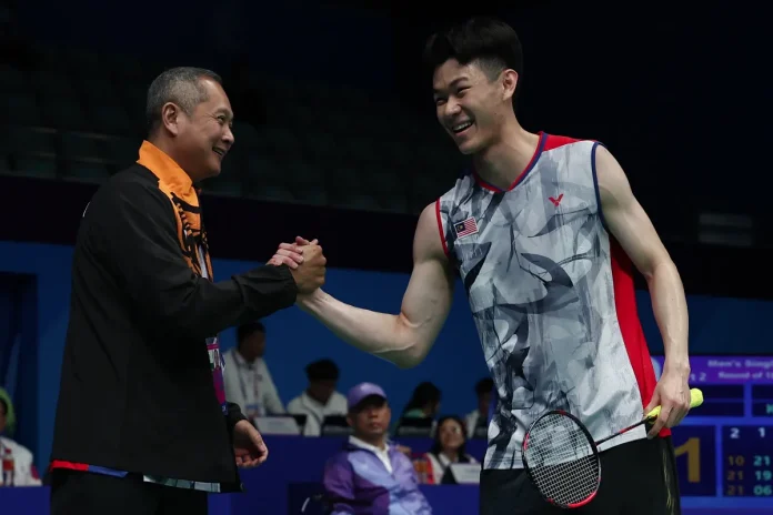 National badminton coach Wong Tat Meng (left) with national men's singles shuttlers Lee Zii Jia - BERNAMAPIX