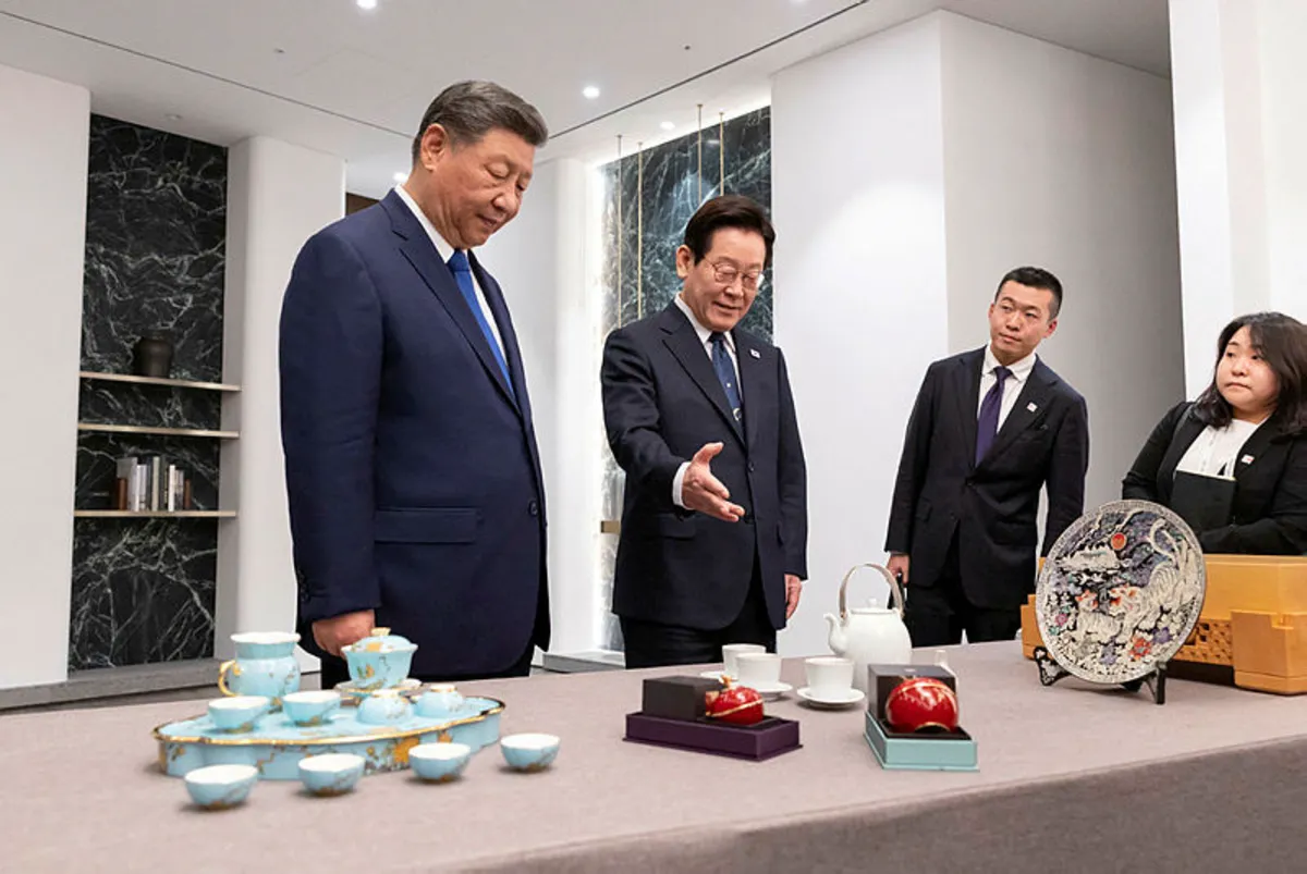 2025-11-02t044337z-763394956-rc24ohavoumx-rtrmadp-3-apec-summit-southkorea-china-t6906d389-m800-x292 China's Xi jokes about 'backdoor' when gifting South Korea's Lee Xiaomi phones