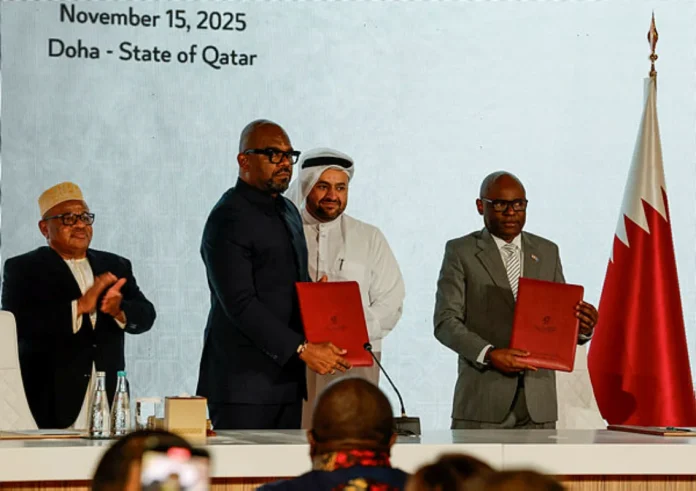 Congo's President Felix Tshisekedi's high representative Sumbu Sita Mambu and head of the M23 rebel group delegation Benjamin Mbonimpa take part in a ceremony to sign a framework agreement for a peace deal aimed at ending fighting in eastern Congo, in Doha, Qatar, November 15, 2025. REUTERS